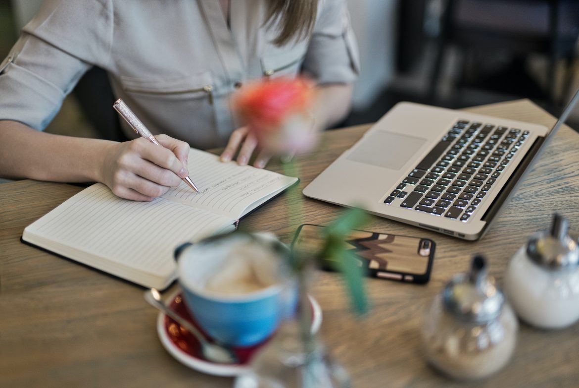 Women writing on a book